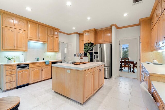 kitchen with ornamental molding, backsplash, a kitchen island, stainless steel fridge with ice dispenser, and light tile patterned flooring