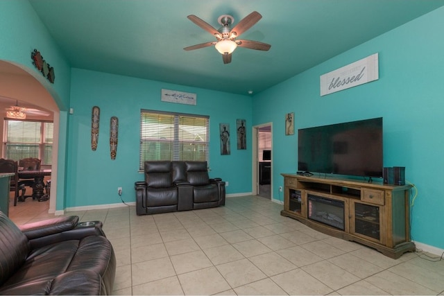 tiled living room with ceiling fan