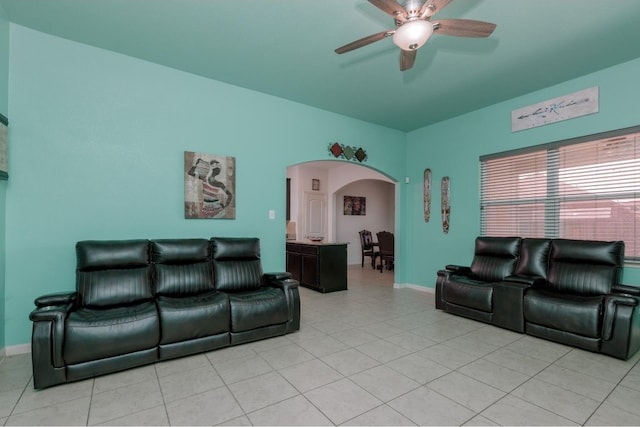 tiled living room featuring ceiling fan