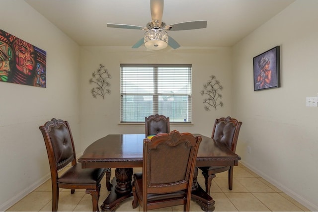 dining space featuring ceiling fan and light tile patterned floors