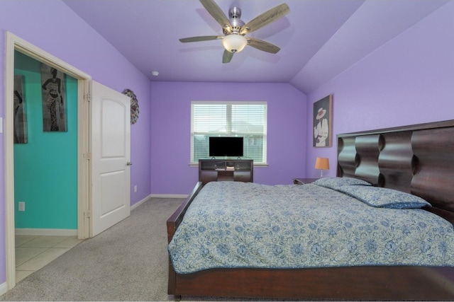 carpeted bedroom with vaulted ceiling and ceiling fan