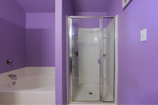 bathroom with separate shower and tub