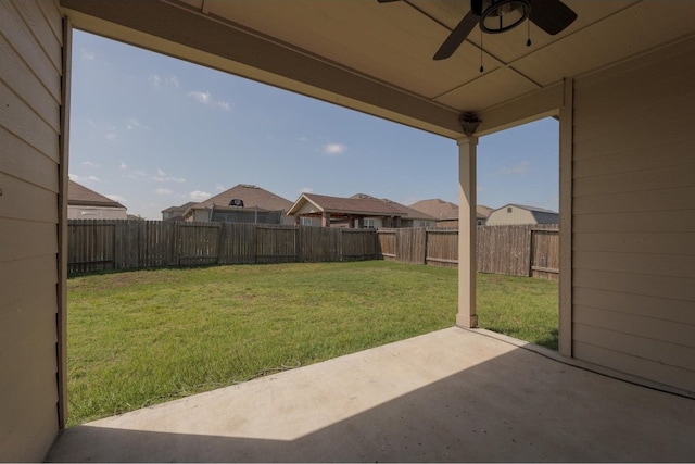 view of yard featuring ceiling fan and a patio area