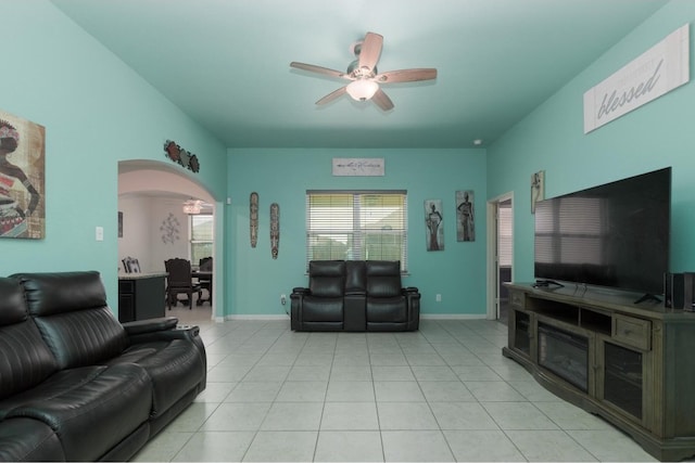 tiled living room featuring ceiling fan