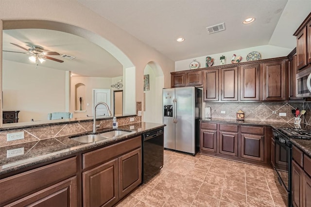 kitchen featuring ceiling fan, tasteful backsplash, lofted ceiling, black appliances, and sink