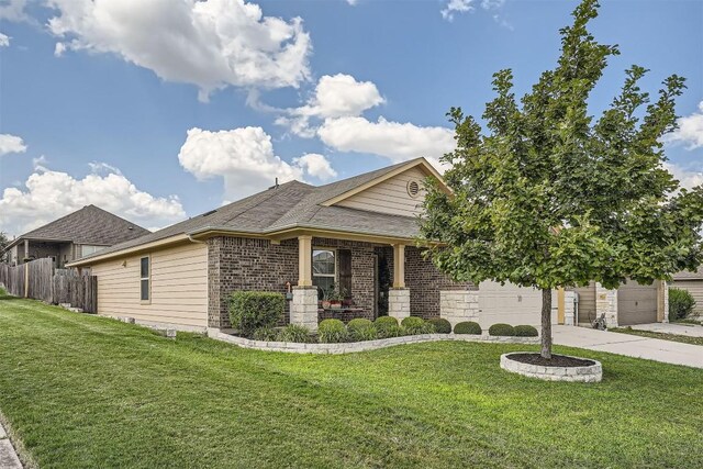 view of front of property with a garage and a front lawn