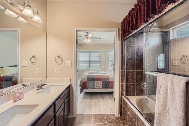 bathroom with ceiling fan, tile patterned floors, shower / bath combination with glass door, and vanity