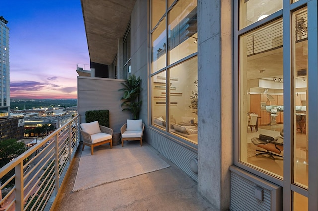 view of balcony at dusk