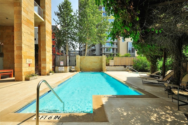 view of pool featuring a patio area