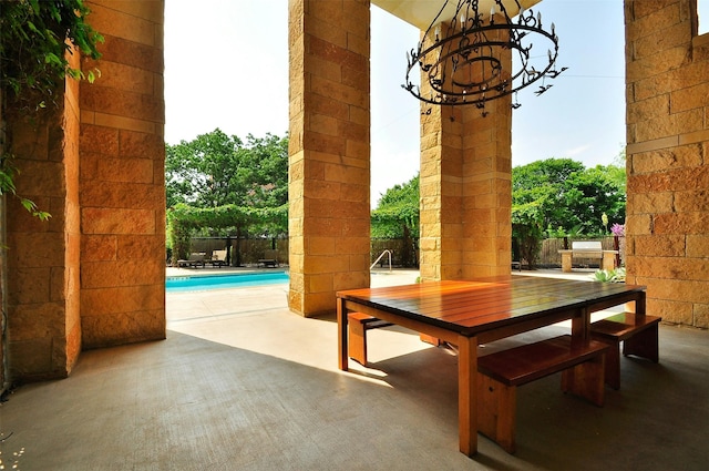 view of patio / terrace with a fenced in pool