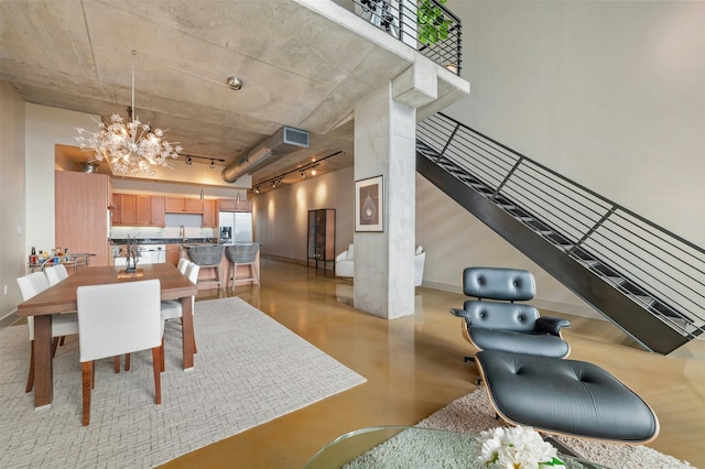 dining area with a notable chandelier and sink