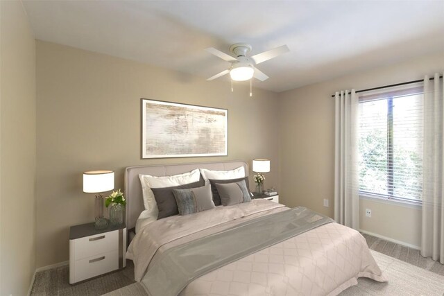 bedroom with a ceiling fan, baseboards, and carpet floors