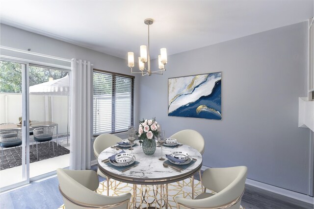 dining area with a notable chandelier, wood finished floors, and baseboards