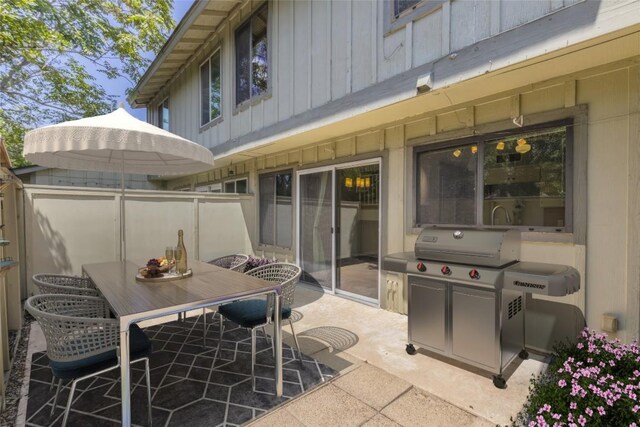 view of patio with outdoor dining area and area for grilling