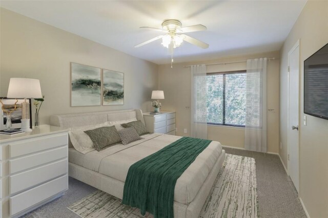 carpeted bedroom with ceiling fan