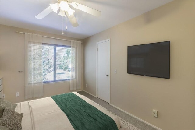 bedroom featuring baseboards, carpet, and a ceiling fan