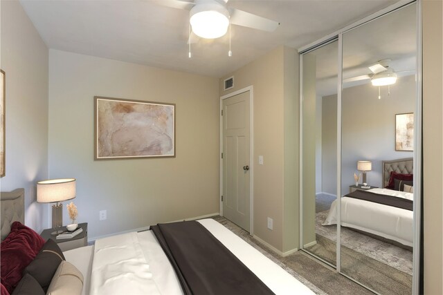 bedroom with a closet, visible vents, baseboards, and ceiling fan