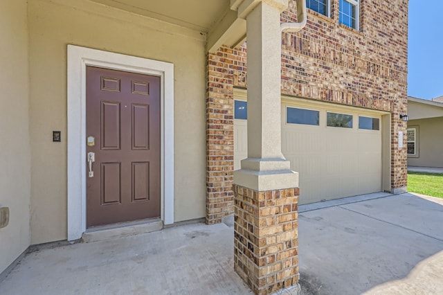 property entrance with a garage