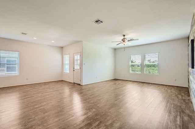 unfurnished room with ceiling fan and hardwood / wood-style floors