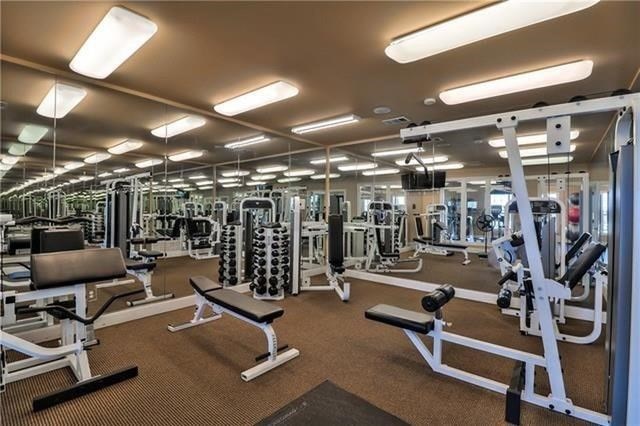 exercise room with carpet flooring