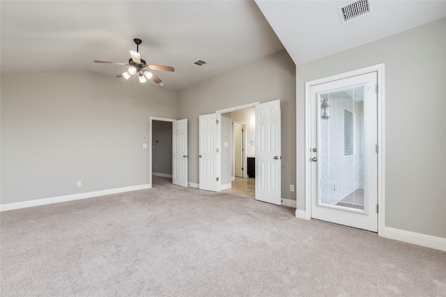 unfurnished bedroom with ceiling fan, access to exterior, light carpet, and lofted ceiling