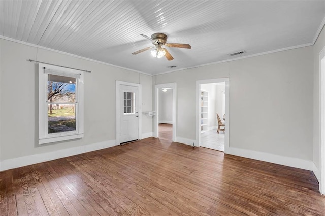 spare room featuring hardwood / wood-style flooring, ceiling fan, and ornamental molding