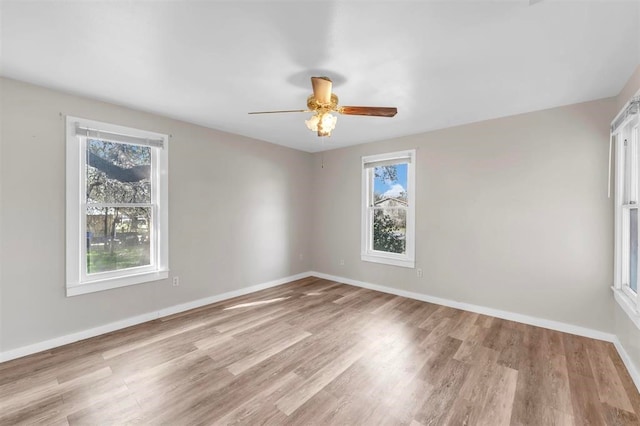 empty room with light hardwood / wood-style floors and ceiling fan