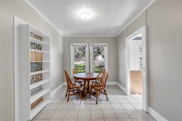 tiled dining space with built in shelves and crown molding