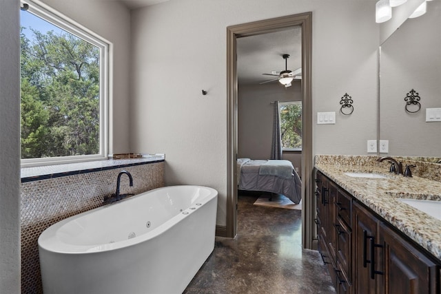 bathroom featuring ceiling fan, double vanity, and concrete flooring