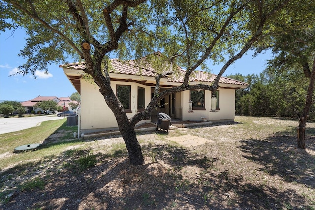 rear view of property with a lawn