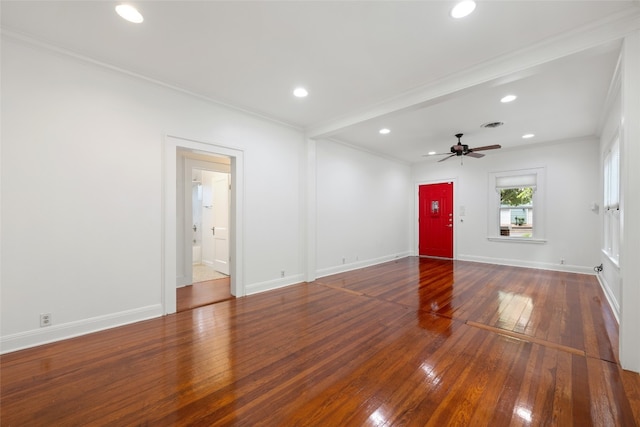 interior space featuring ensuite bath, crown molding, and hardwood / wood-style floors