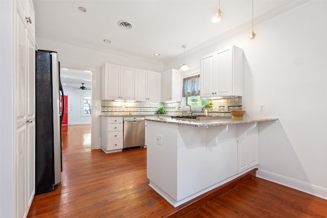 kitchen featuring hardwood / wood-style floors, kitchen peninsula, light stone countertops, stainless steel dishwasher, and refrigerator