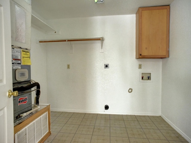 clothes washing area featuring hookup for a washing machine, cabinet space, baseboards, and hookup for an electric dryer