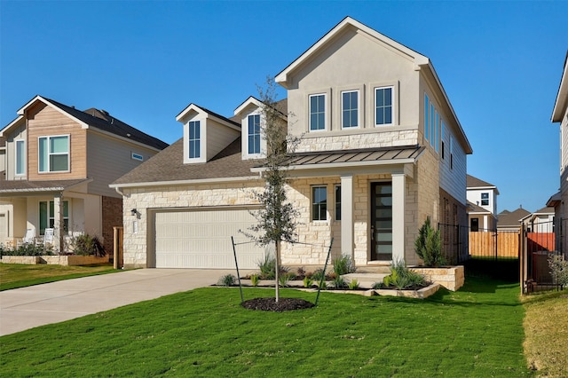 view of front of home with a garage and a front lawn