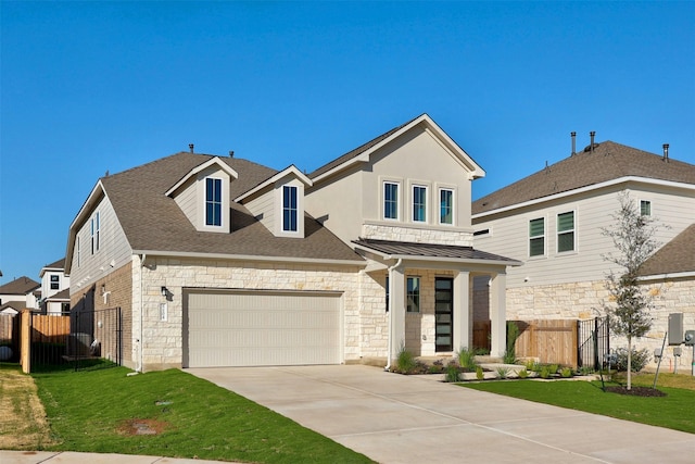 view of front of property featuring a garage and a front yard