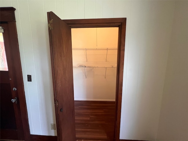 corridor with dark hardwood / wood-style floors