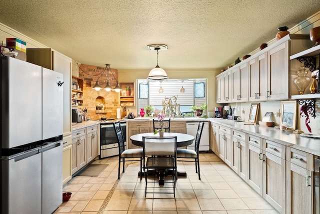 kitchen featuring hanging light fixtures, light tile patterned flooring, stainless steel appliances, a textured ceiling, and ornamental molding