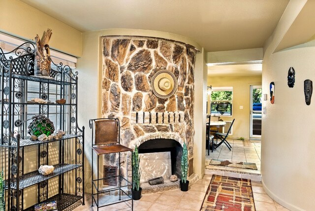 interior space featuring tile patterned floors and a fireplace