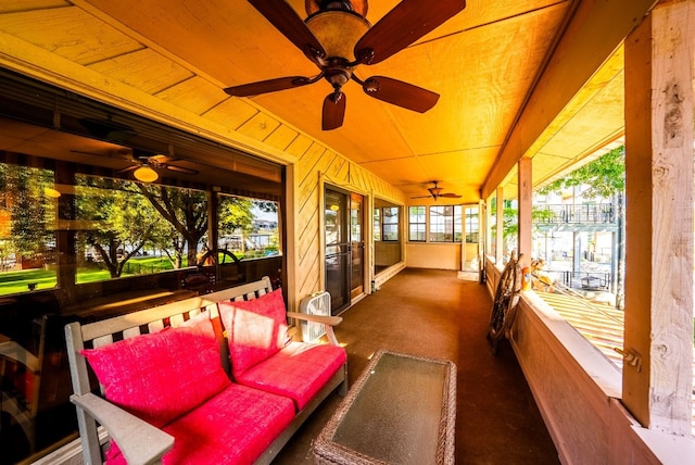 sunroom / solarium with ceiling fan