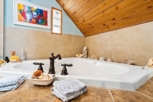 bathroom with wooden ceiling, tile walls, lofted ceiling, and a tub