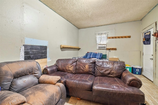 tiled living room featuring a textured ceiling