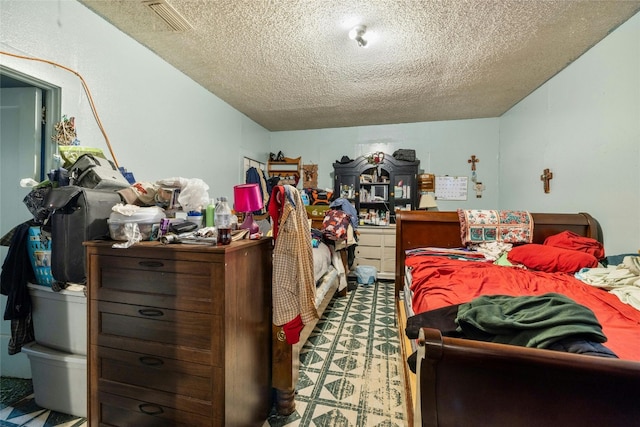 bedroom featuring a textured ceiling