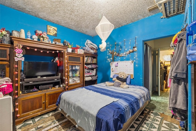 bedroom featuring a textured ceiling