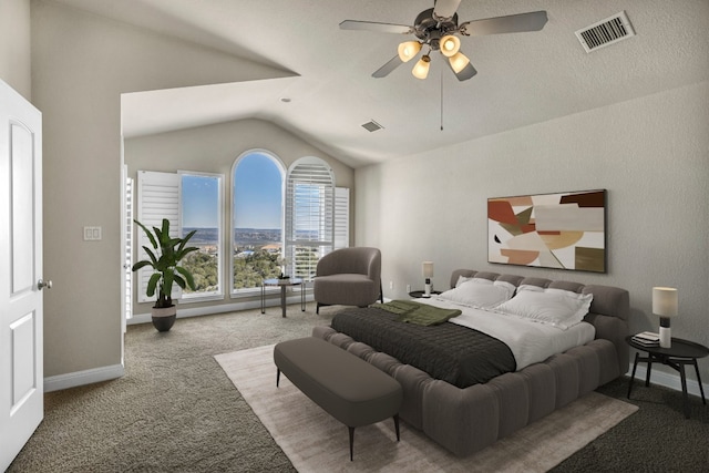 bedroom with ceiling fan, a textured ceiling, light colored carpet, and lofted ceiling