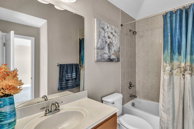 full bathroom featuring toilet, shower / tub combo with curtain, and vanity