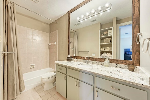 full bathroom with tile patterned flooring, vanity, a textured ceiling, toilet, and shower / bath combo with shower curtain