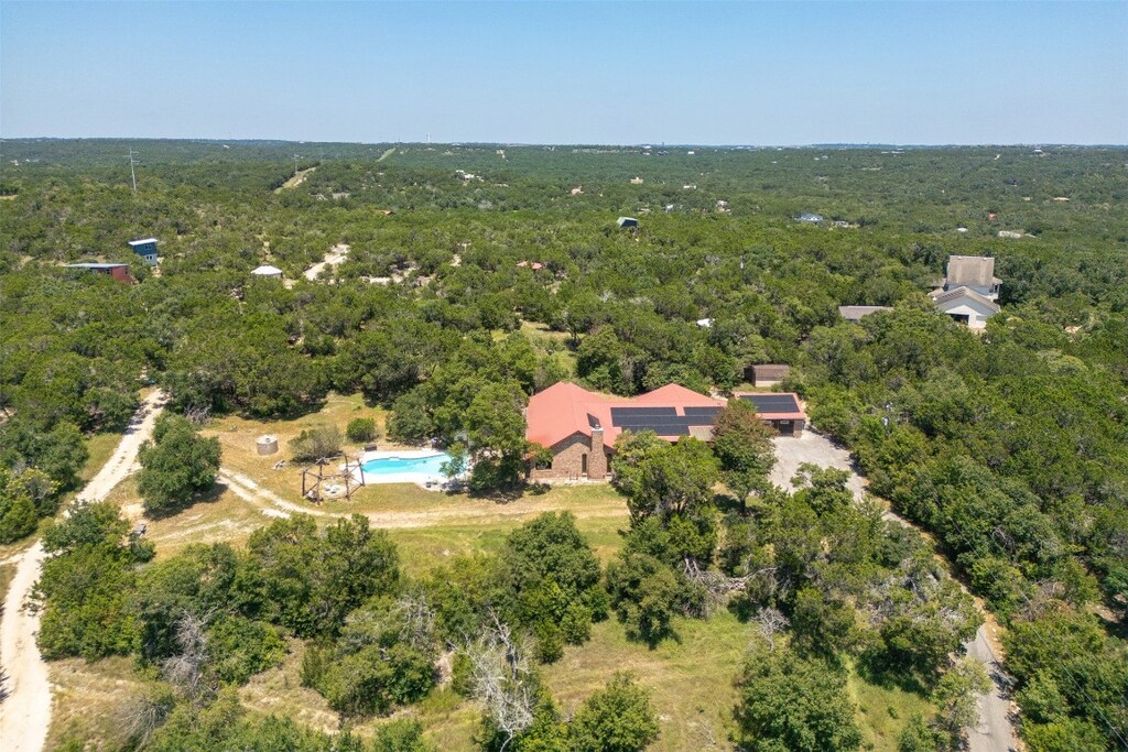 9000 Bear Creek Dr, Austin, TX 78737 - aerial view of property and surrounding area featuring a heavily wooded area and a pool area