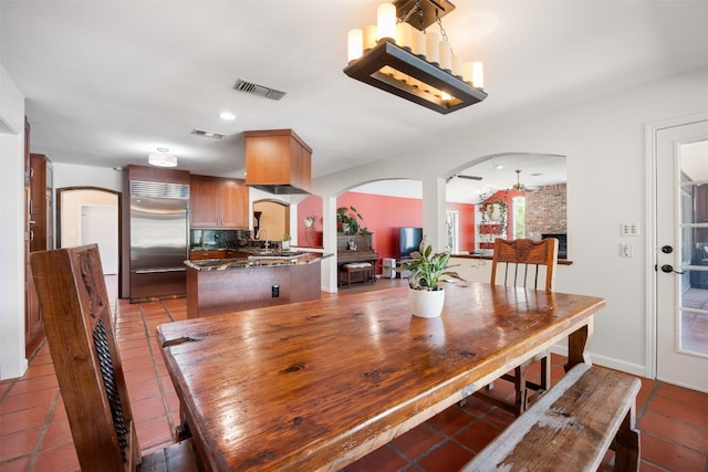 dining area with tile patterned flooring and sink