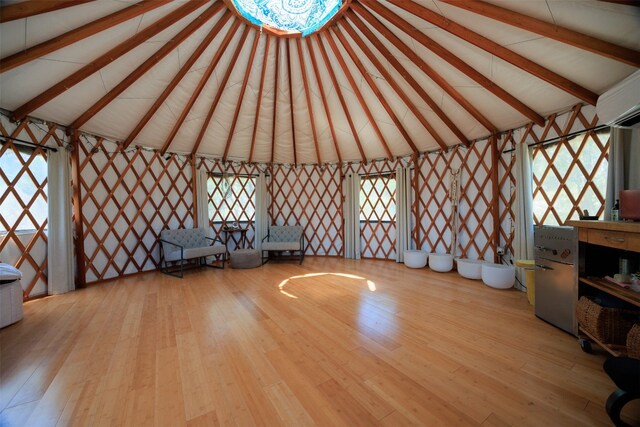 9000 Bear Creek Dr, Austin, TX 78737 - misc room with wood finished floors, beam ceiling, and high vaulted ceiling