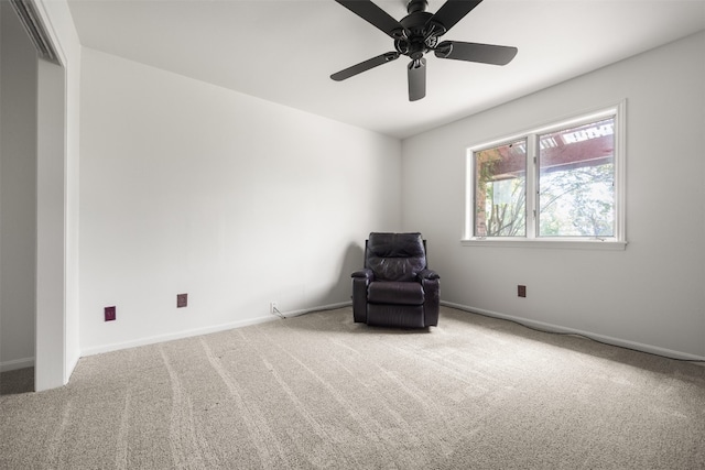 unfurnished room featuring ceiling fan and carpet flooring